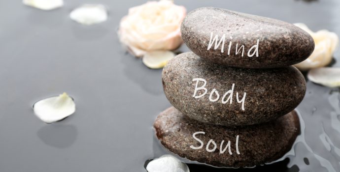 stones,with,words,mind,,body,,soul,and,flower,petals,in