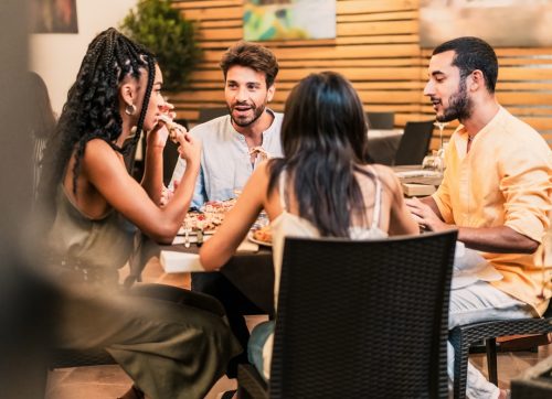 diverse,group,of,friends, ,enjoying,dinner,and,conversation,at