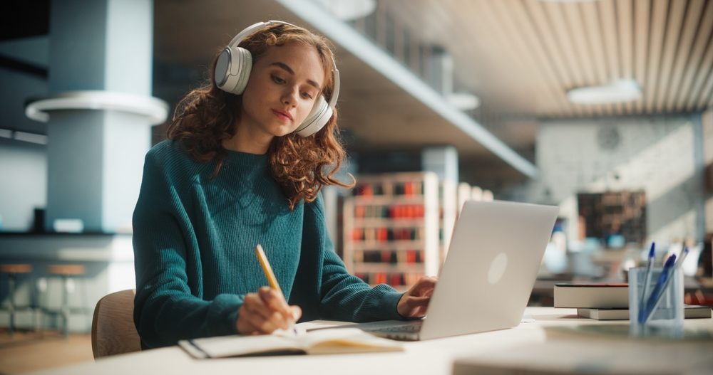 concentrated,young,female,student,engaged,in,academic,research,with,laptop concentrated,young,female,student,engaged,in,academic,research,with,laptop