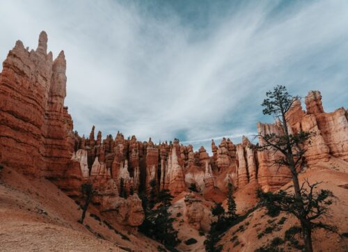 dramatic,landscape,of,bryce,canyon,under,a,cloudy,blue,sky