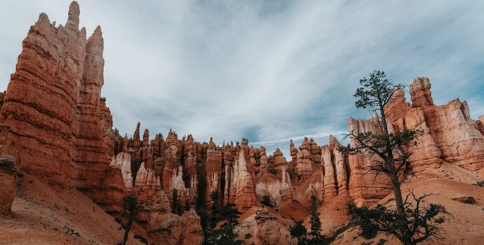 dramatic,landscape,of,bryce,canyon,under,a,cloudy,blue,sky