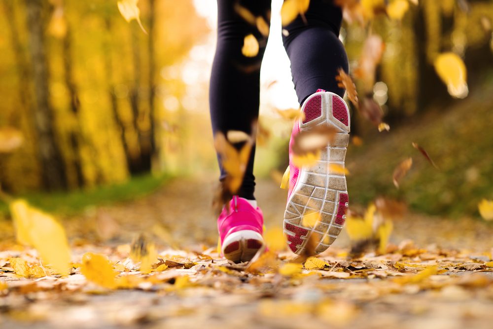 close,up,of,feet,of,a,runner,running,in,autumn