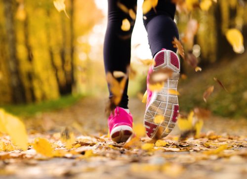 close,up,of,feet,of,a,runner,running,in,autumn
