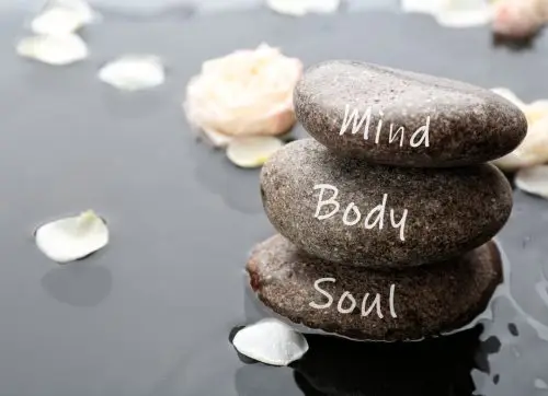 stones,with,words,mind,,body,,soul,and,flower,petals,in